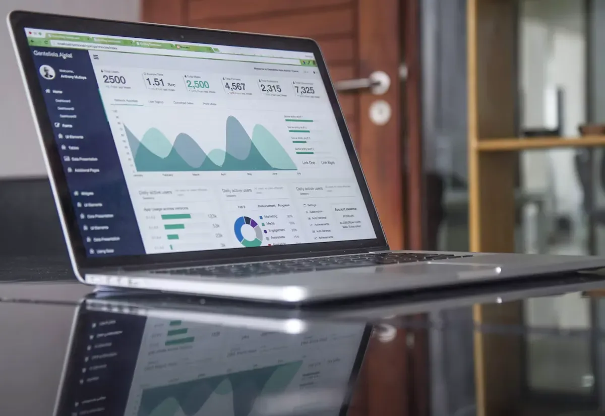 Laptop showing an analytics dashboard with charts